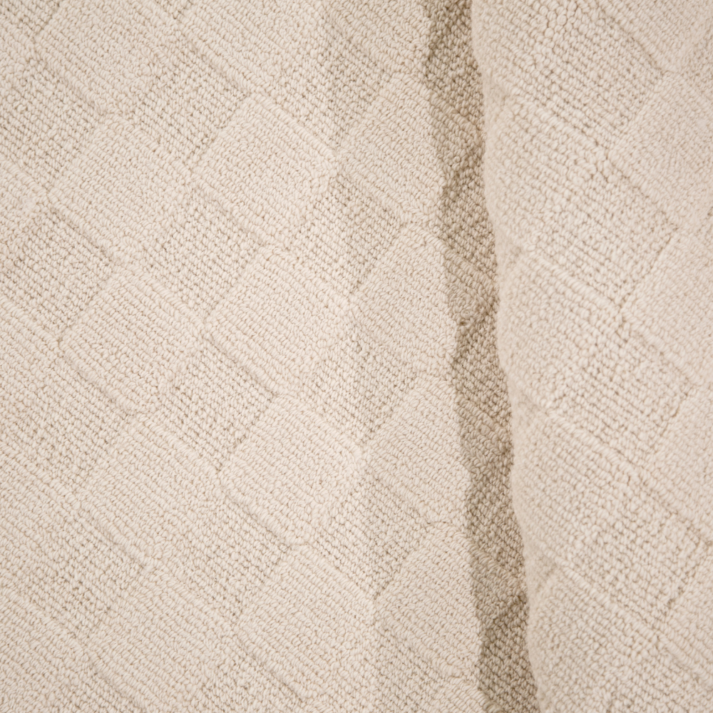 Textured cream washable rug with diamond pattern for modern home interiors.