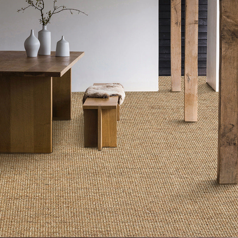 Earthy jute rug under wooden dining table and bench