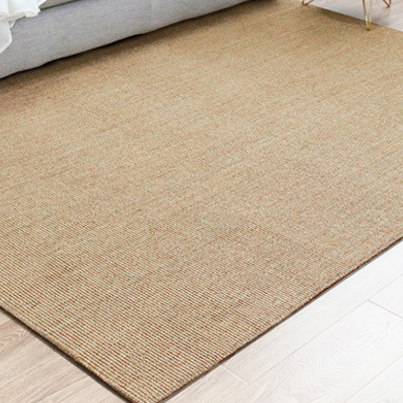 Textured jute rug in earthy tones, perfect for stylish and functional living spaces.