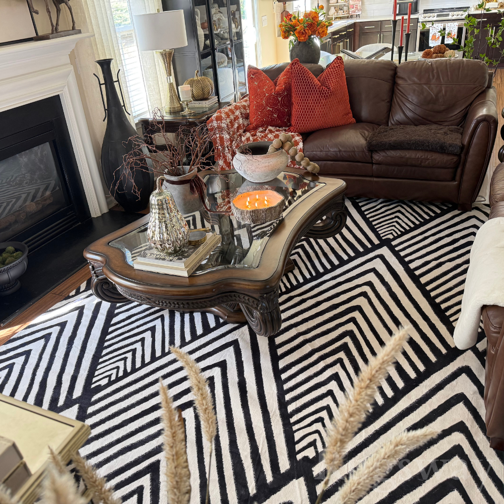 Zigzag black and white rug adding style to a cozy modern living room.