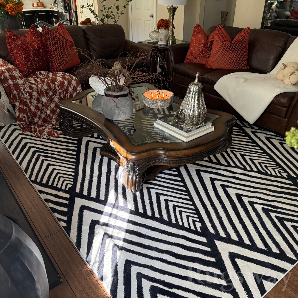 Zigzag black and white rug enhancing a cozy modern living room decor