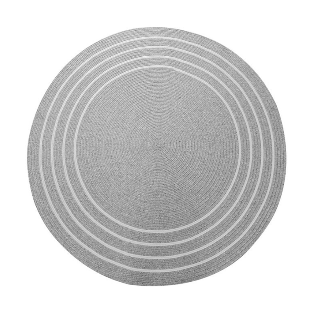 Round gray woven rug with contour lines, perfect for modern and traditional interiors.