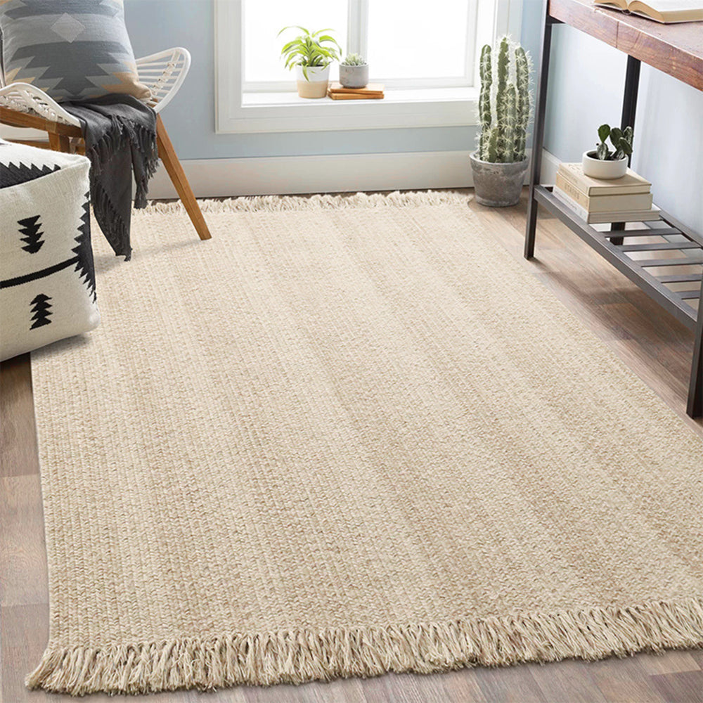 Beige rustic woven rug with fringed edges, perfect for stylish and durable home decor.