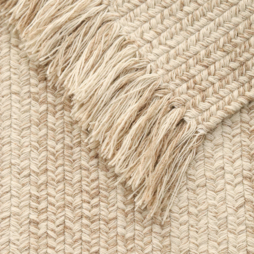 Beige rustic weave rug with fringed edges, elegant and water-resistant home decor.