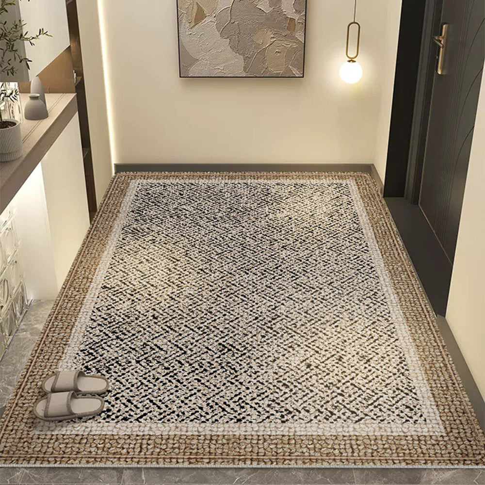 Neutral herringbone pattern rug enhancing a sophisticated entryway decor