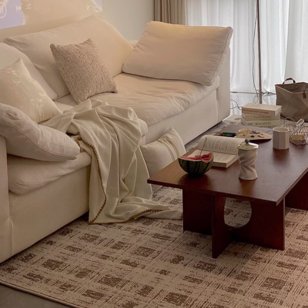 Beige and cream Theon Checkered Washable Rug under a cozy living room setup