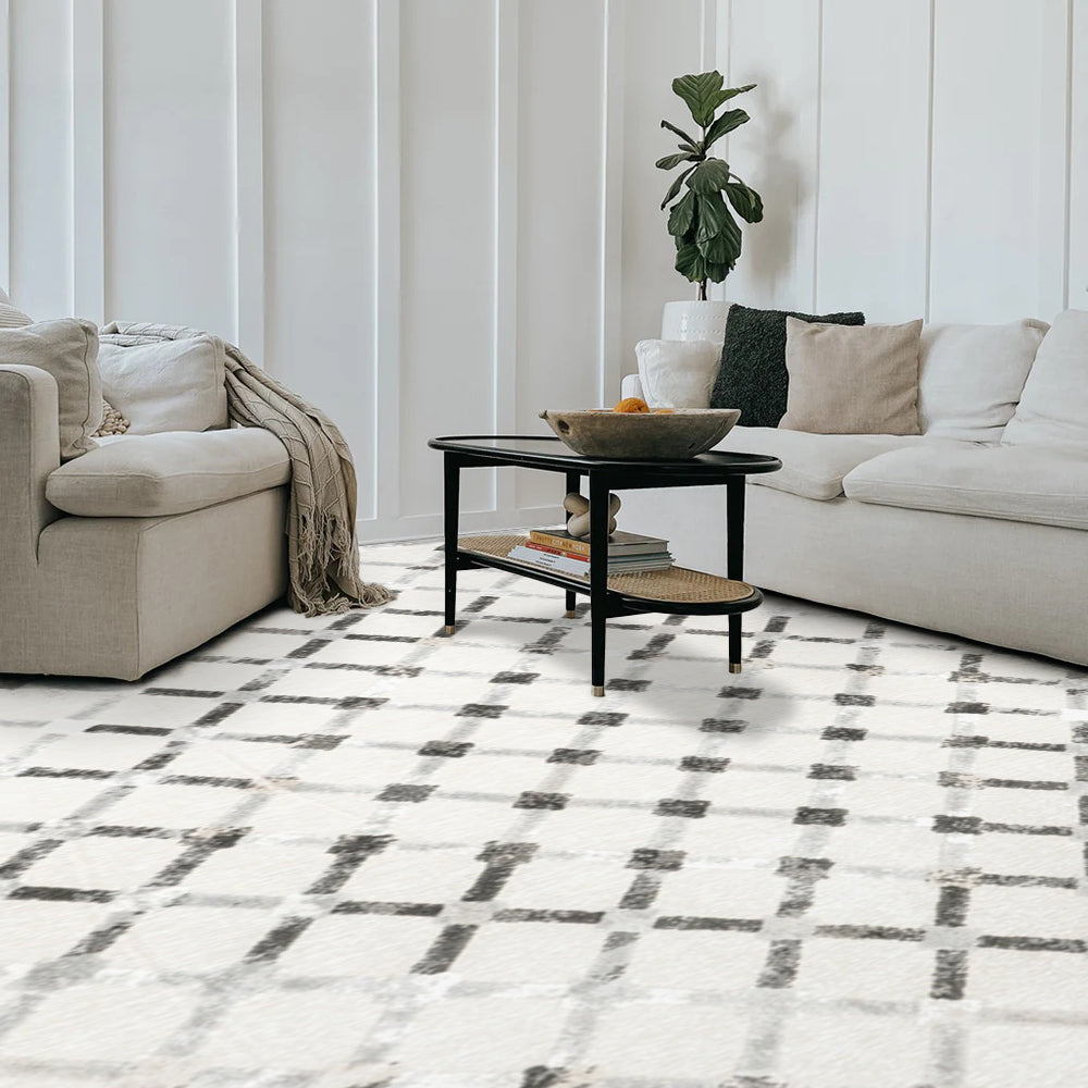 Elio Checkered Washable Rug with geometric design in a stylish living room setup.