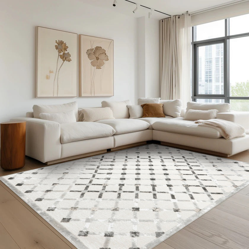 Elio Checkered Washable Rug in a modern living room with light decor.