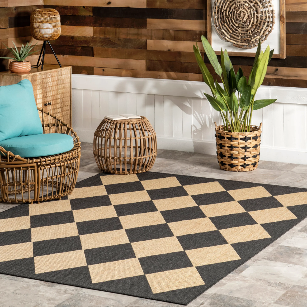 Damian checkered washable rug in modern living room with black and beige diamonds.