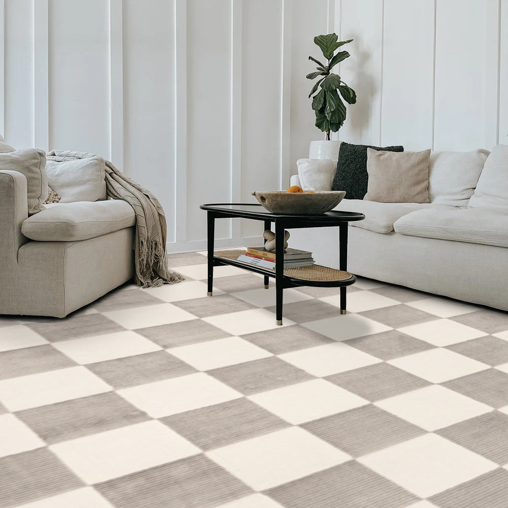 Elias Checkered Washable Rug in gray and cream on modern living room floor.