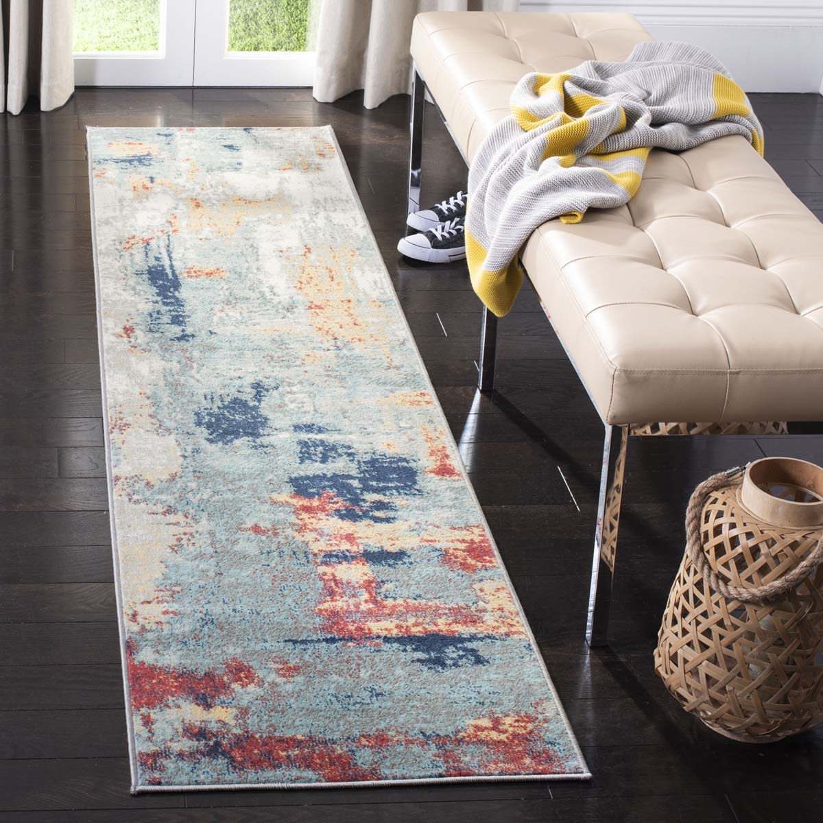 Long abstract washable rug in blue, red, and beige for modern interiors.