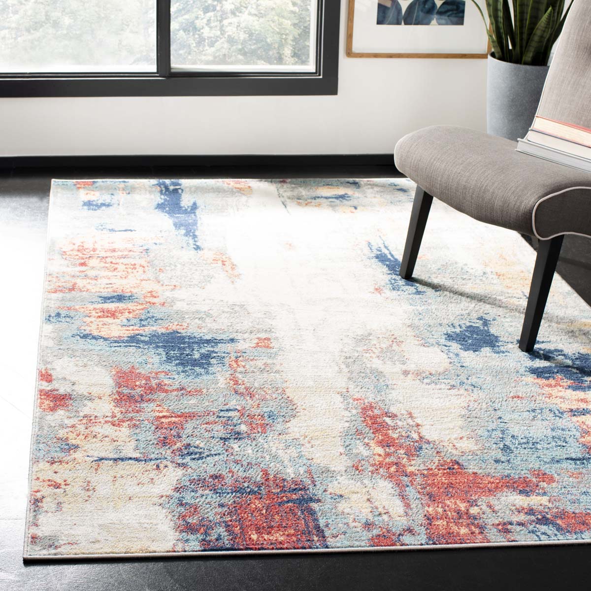 Colorful abstract washable rug with blue, red, and beige patterns for stylish interiors.