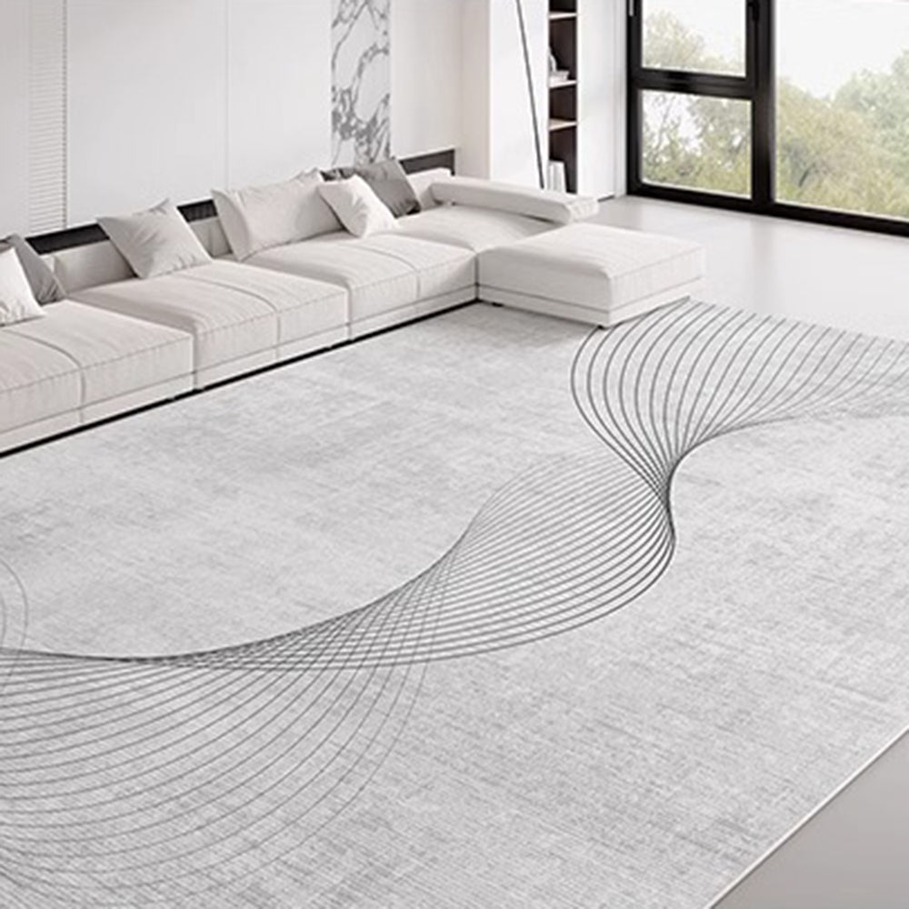 Whispering River Curvo rug with elegant swirl design in contemporary living room