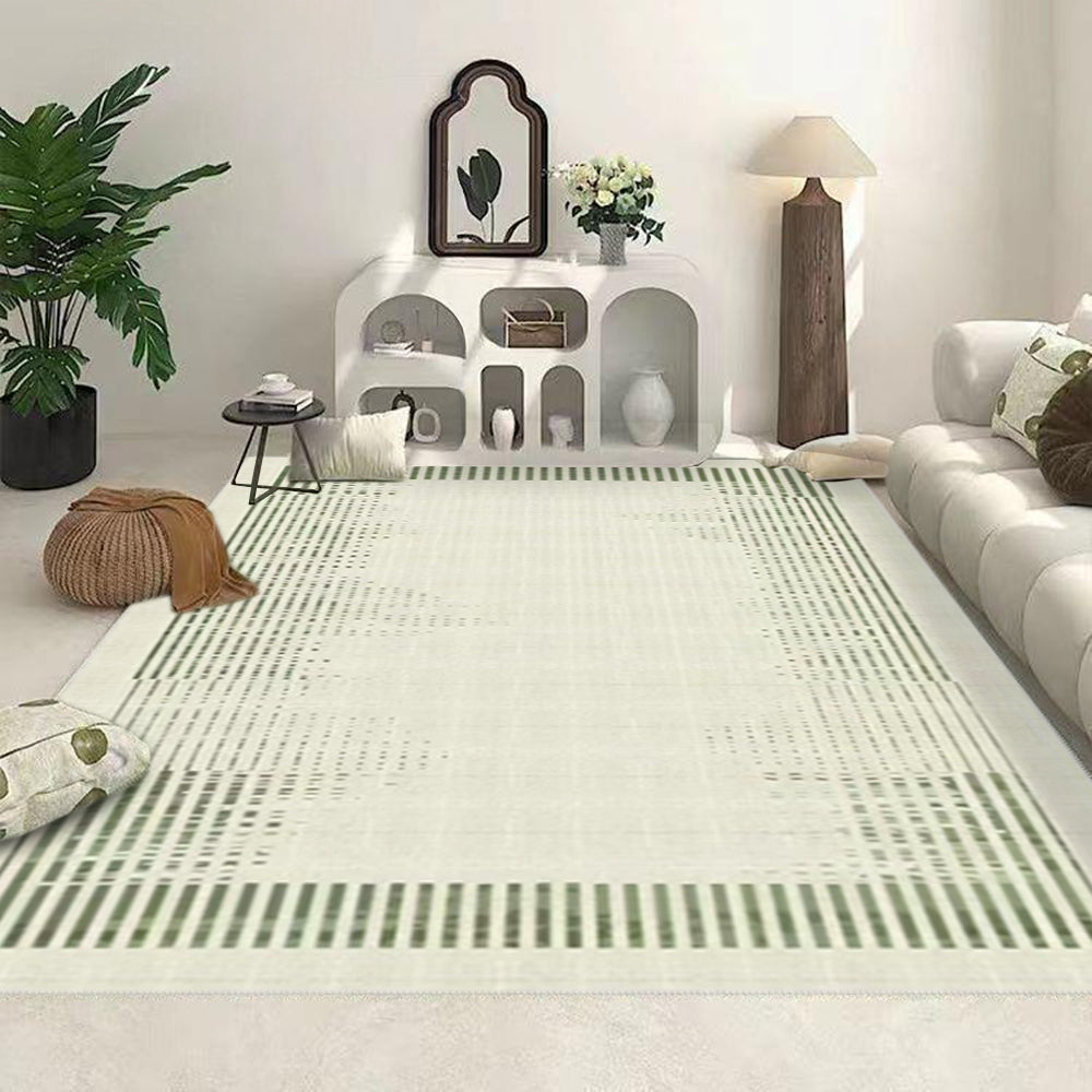 Washable green and cream striped rug in a modern living room