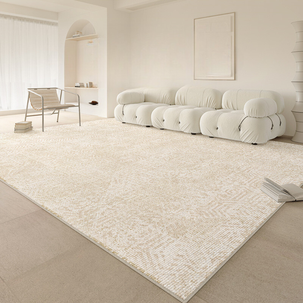 Light beige geometric rug in a modern living room with white furniture