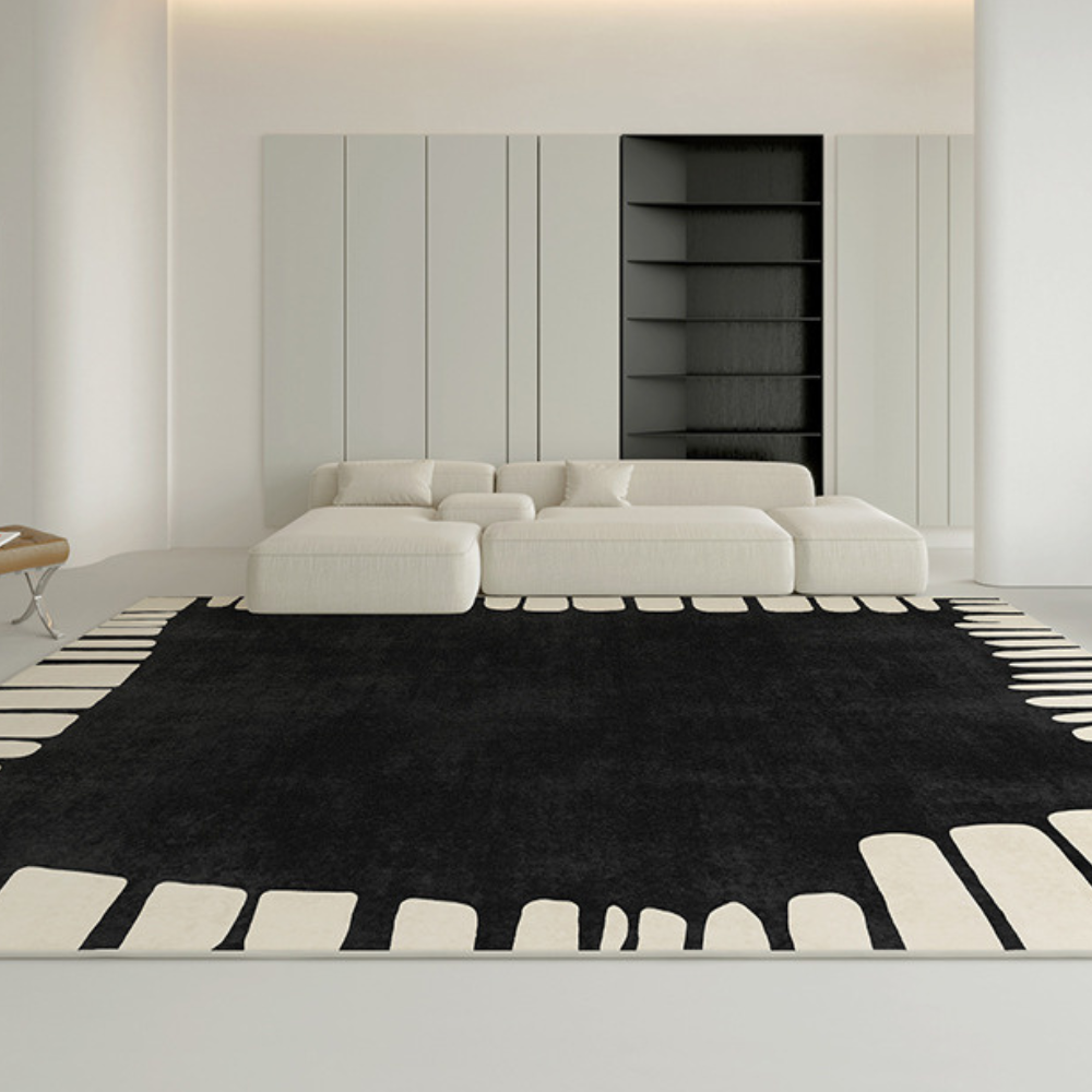 Contemporary black and white rug enhancing minimalist living room decor.