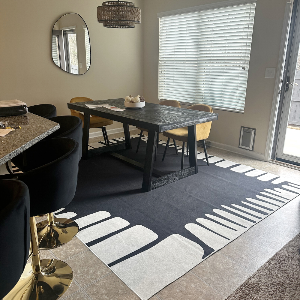 Stylish black and white abstract rug in contemporary dining area