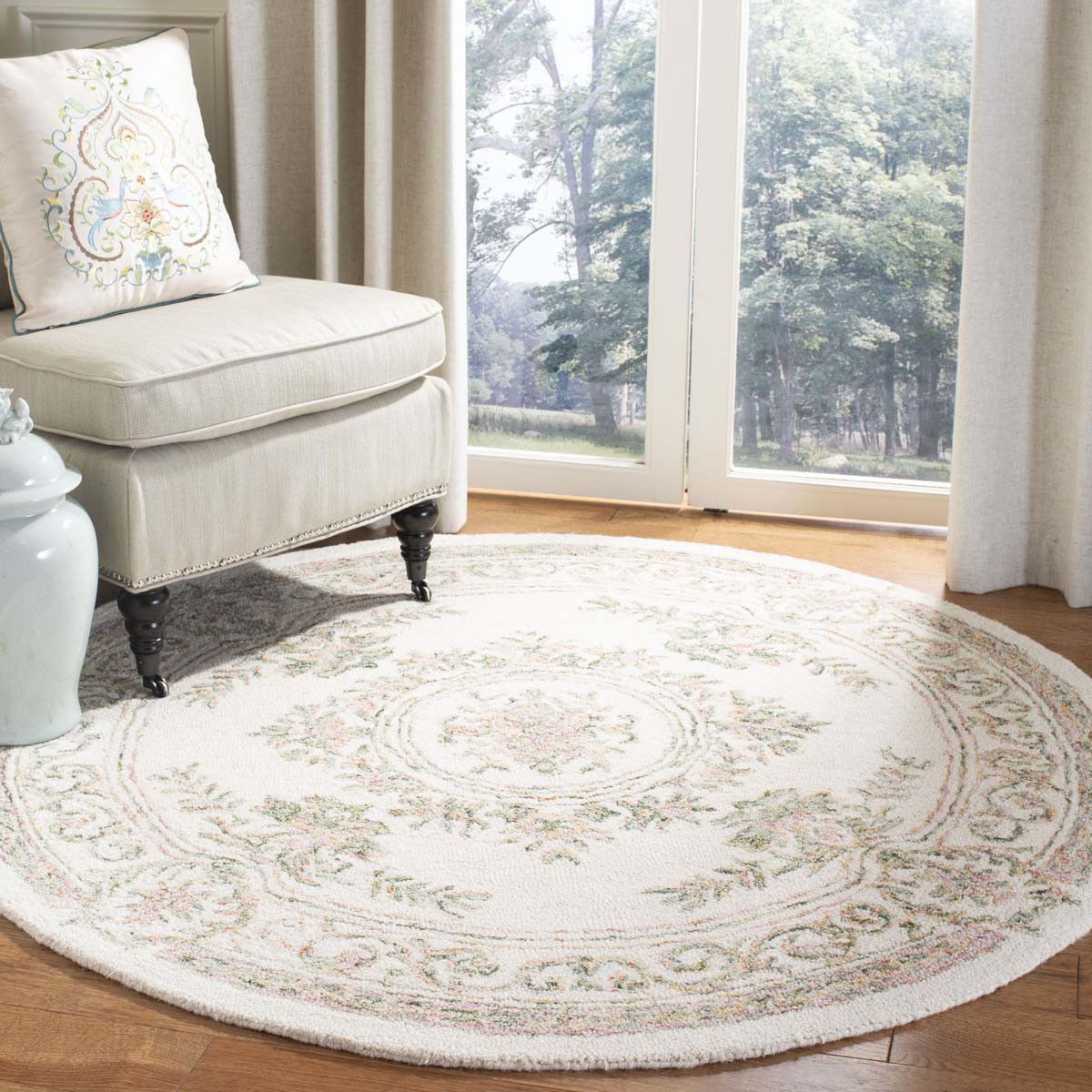 Floral round Timeless Reflection rug in soft hues, perfect for elegant home decor.