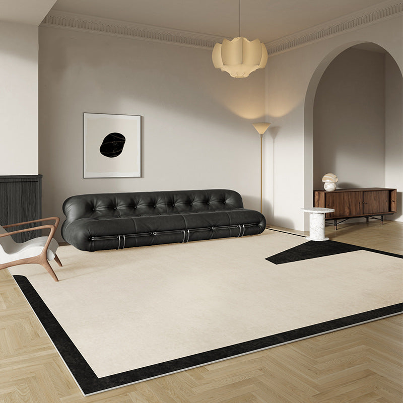 Beige and black abstract rug in a contemporary styled living room