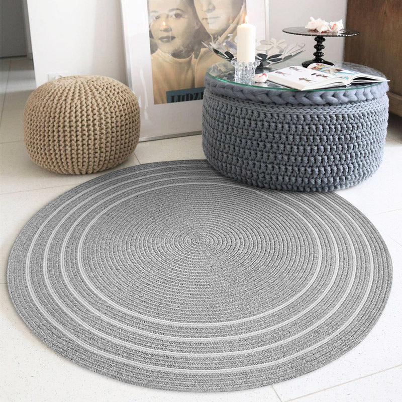 Gray round woven rug with contour lines for stylish home decor