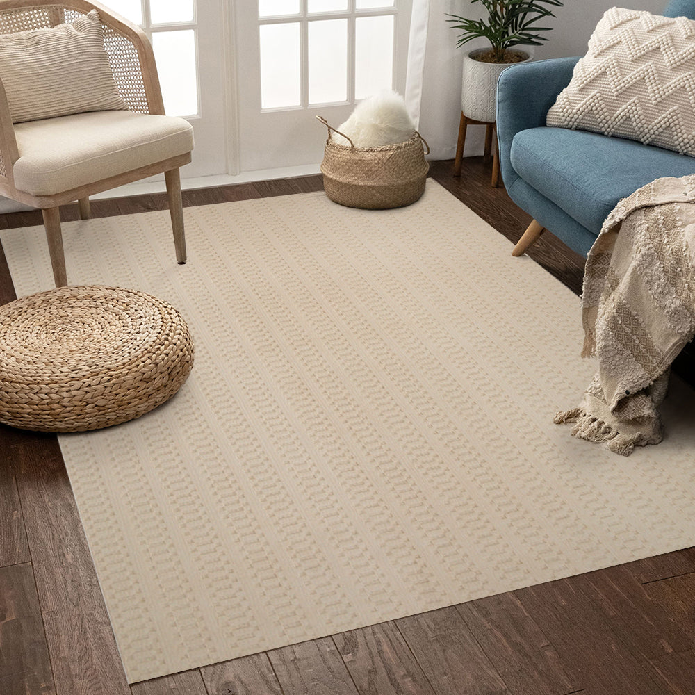 Textured beige woven rug in a cozy living room with blue couch